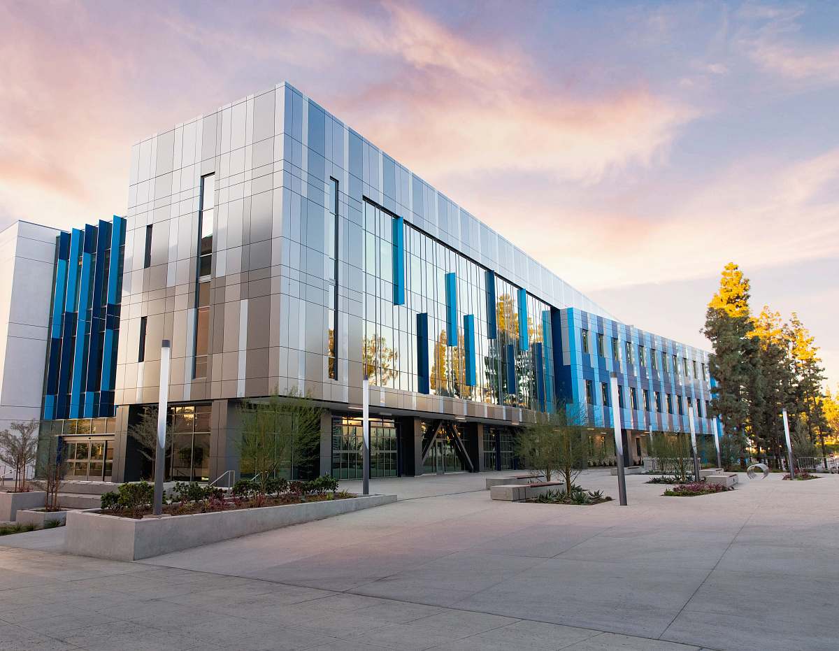 office building building near trees during day architecture